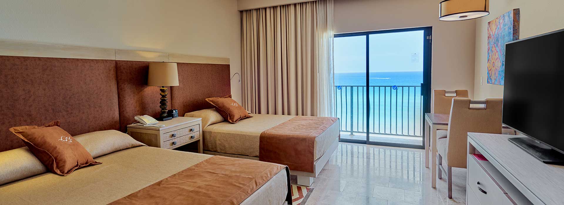 Beachfront Junior suite with double beds in Cancun beachfront resort