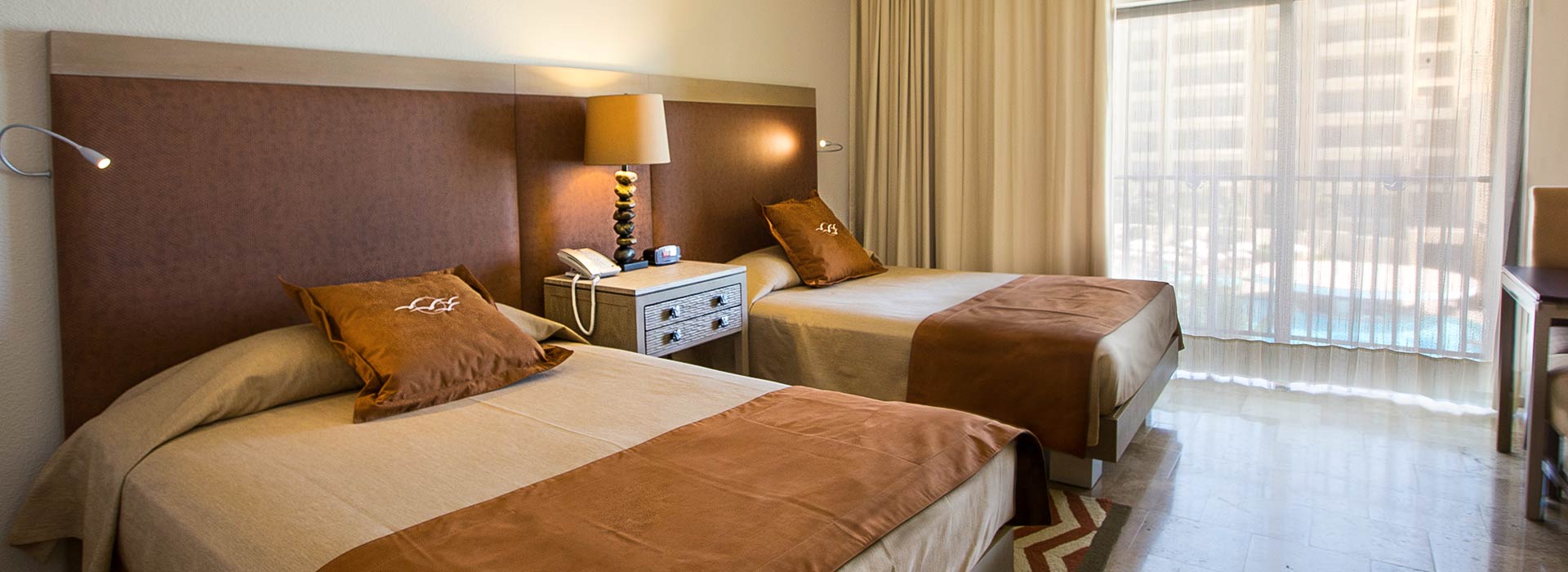 Ocean View Junior suite with double beds in Cancun beachfront resort
