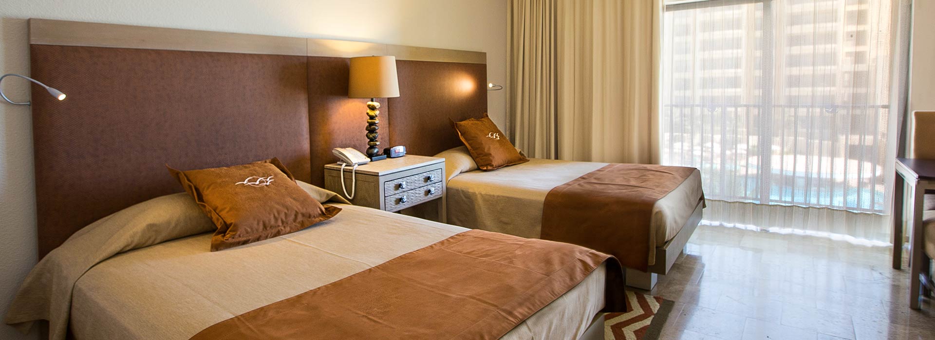 Ocean View Junior suite with double beds in Cancun beachfront resort
