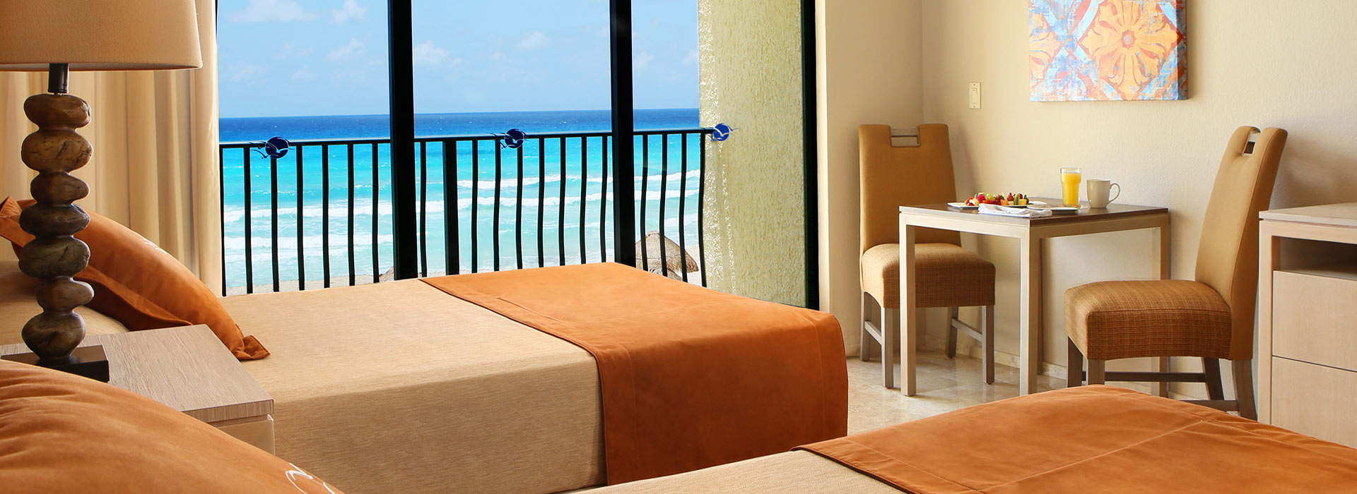 Ocean View Junior suite with ample seating area by the Mexican Caribbean Sea
