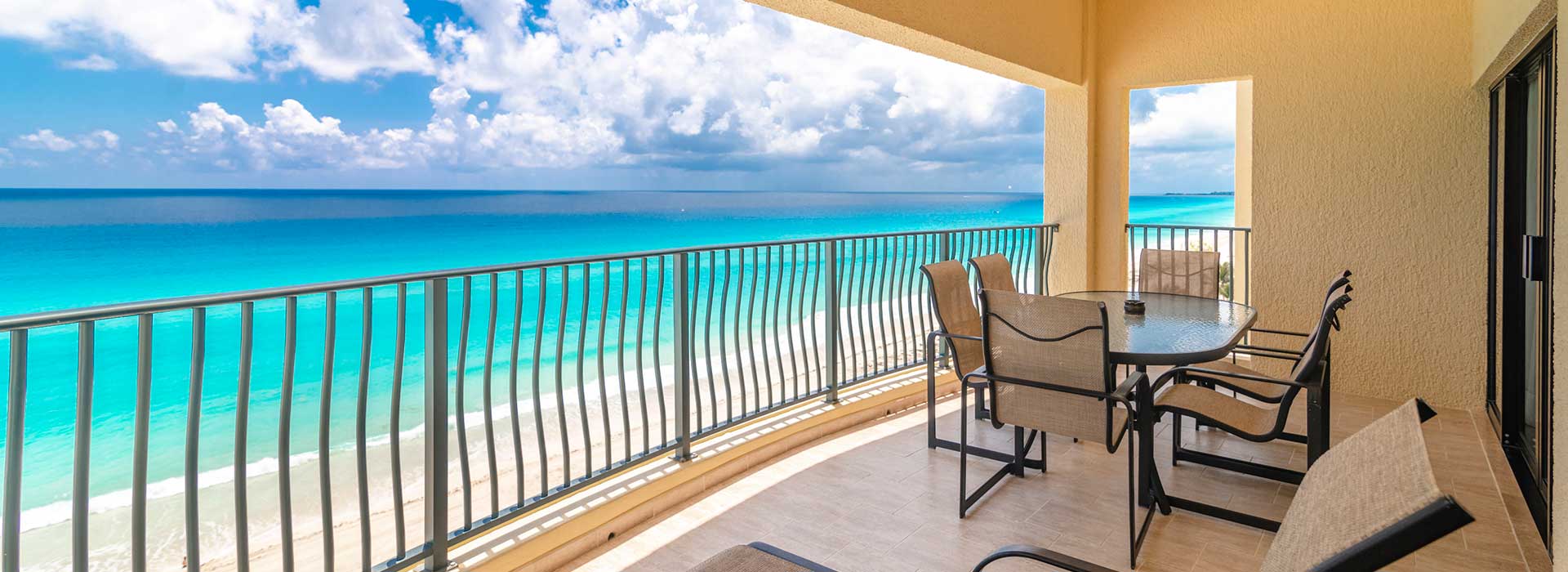 Private balcony with spectacular ocean views at your one bedroom beachfront suite